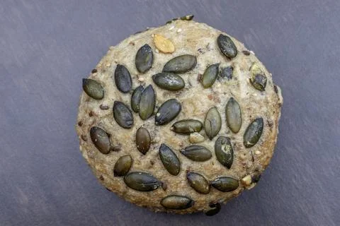 Pumpkin seed rolls bread: Nutritious product of rough grinding. Stock Photos