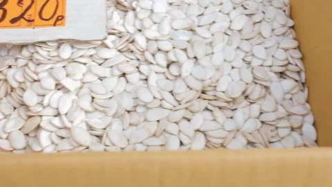 Pumpkin seeds in a box in bulk mix ingredient Stock-Footage 139142292