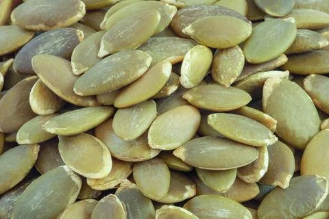 Pumpkin seeds close up for background. Stock Photos