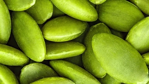 Pumpkin seeds close-up, green, in bulk, full depth of field, rotating 스톡 동영상 240655689