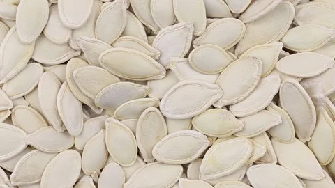 Pumpkin seeds close up. Loop rotation. Rotates plate with pumpkin seeds Stock Footage 69786700