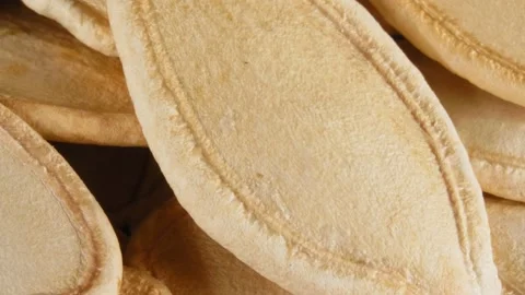 Pumpkin seeds close-up. The seeds in the white peel. Stockbeeldmateriaal 140929068