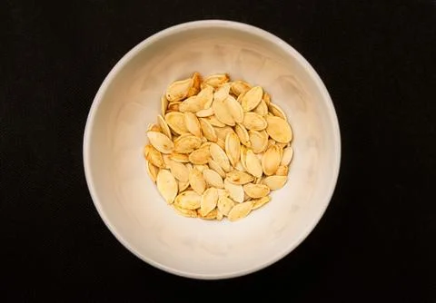 Pumpkin seeds in a cup Stock Photos