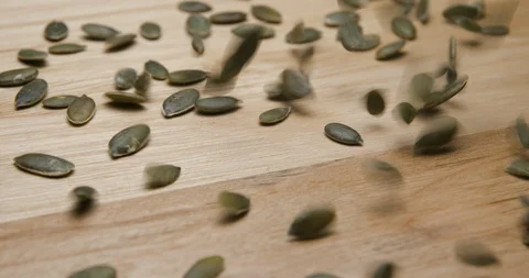Pumpkin seeds falling and rotating studio macro 库存影片 101470187
