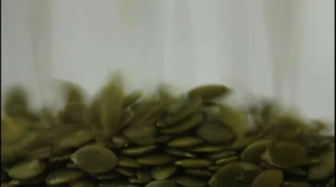 Pumpkin seeds falling Stock Footage 12625074