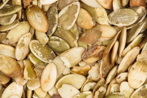Pumpkin seeds on macro. Stock Photos