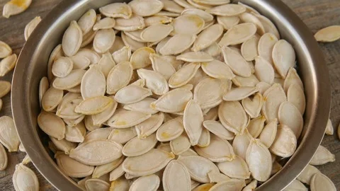 Pumpkin seeds in a metal plate. Stock Footage