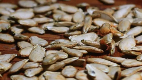 Pumpkin seeds on plate Stock Footage 291283871