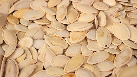 Pumpkin seeds seed looping texture pattern closeup video Stock-Footage 99014707