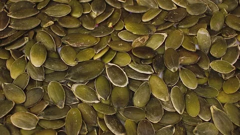 Pumpkin seeds seed looping texture pattern closeup video Stock-Footage 99015251