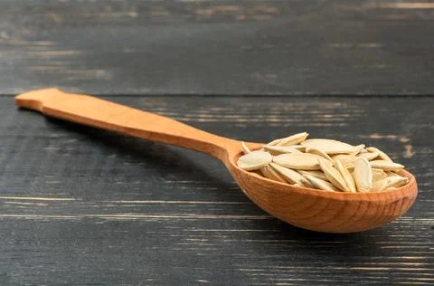 Pumpkin seeds in a spoon Stock Photos