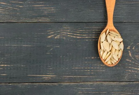 Pumpkin seeds in a spoon Stock Photos