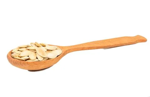 Pumpkin seeds in a spoon Stock Photos