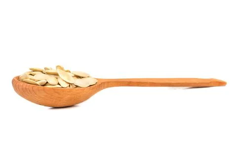 Pumpkin seeds in a spoon Stock Photos