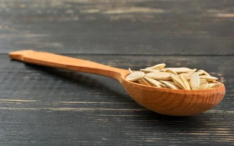 Pumpkin seeds in a spoon Stock Photos