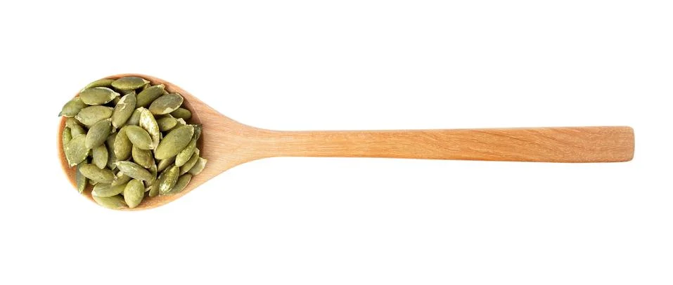 Pumpkin seeds on a white background Stock Photos