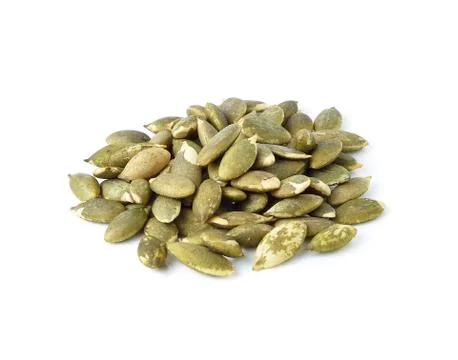 Pumpkin seeds on a white background Stock Photos