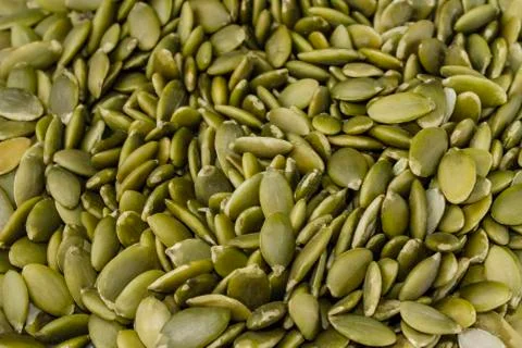 Pumpkin seeds on a white background Stock Photos