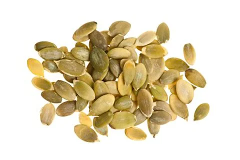 Pumpkin seeds on white Stock Photos