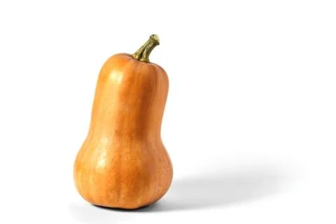 Pumpkin in the shape of a pear on a white background, close-up Stock Photos