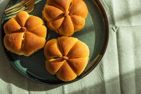 Pumpkin shaped bread rolls on a plate for autumn Stock Photos