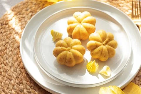 Pumpkin shaped muffins featuring autumn harvest treats Stock Photos