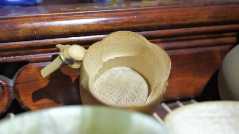 Pumpkin sieve tea ceremony. Close-up Stock Footage 147279896