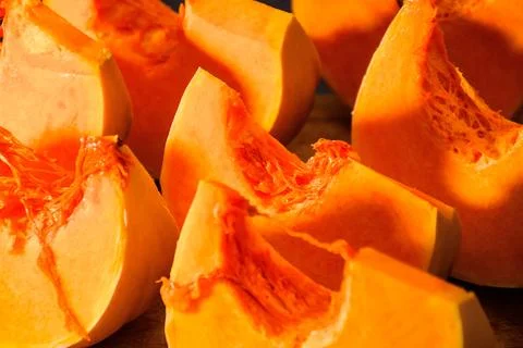 Pumpkin slice on wooden board Stock Photos