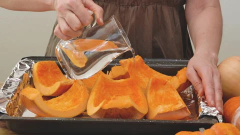 Pumpkin slices close up on a prepared baking pan. Stock Footage 149387222