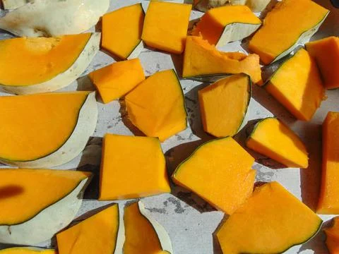 Pumpkin slices ready to be put in the oven Photos