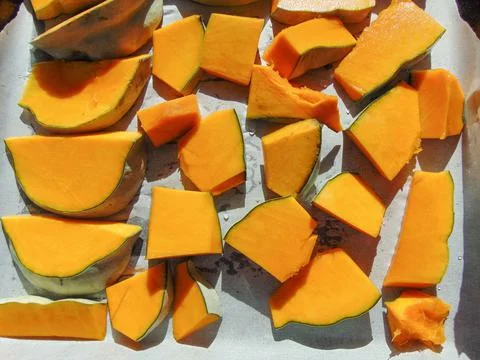 Pumpkin slices ready to be put in the oven Stock Photos
