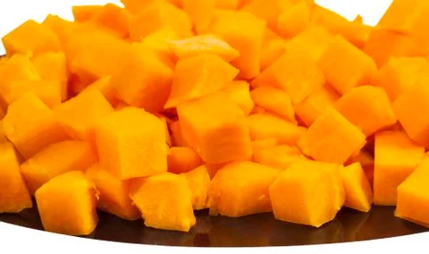 Pumpkin small square blocks on plate Stock Photos