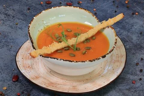 Pumpkin Soup on Blue Table Stock Photos