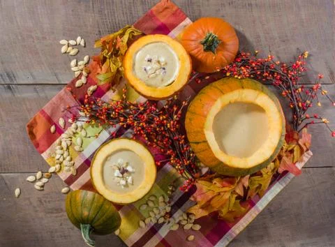 Pumpkin soup with fall decorations Stock Photos