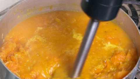 Pumpkin soup with an immersion blender Stock Footage 168101283