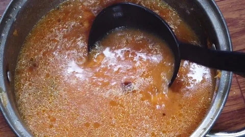 Pumpkin soup in a pan top view slow motion Video stock 127362489