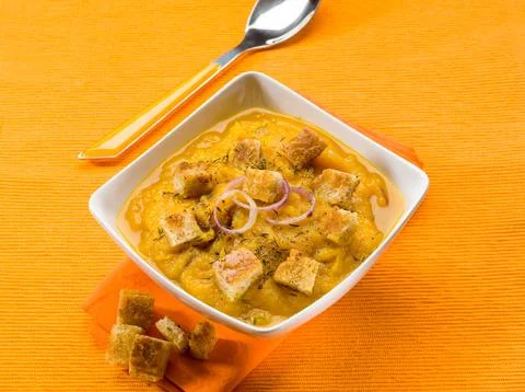Pumpkin soup with sliced toasted bread Stock Photos