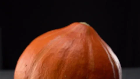 Pumpkin spliting infront of black Background Stock Footage 165216485
