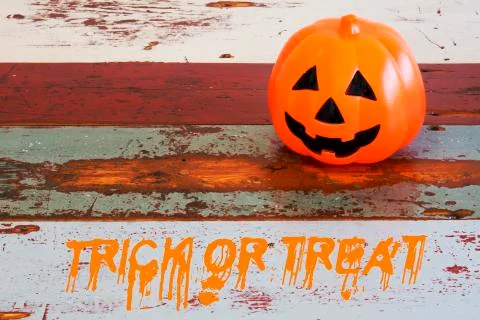 Pumpkin on table with words 'trick or treat' Stock Photos