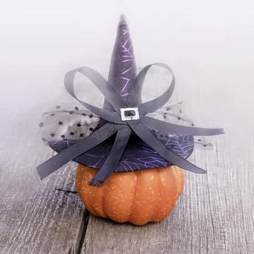 Pumpkin wearing a Witch's hat on old wooden planks Stock Photos