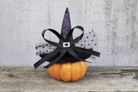 Pumpkin wearing a Witch's hat on old wooden planks Stock Photos