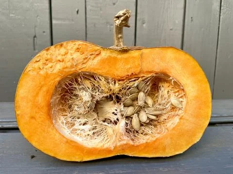 Pumpkin on a wooden table and wall Stock Photos