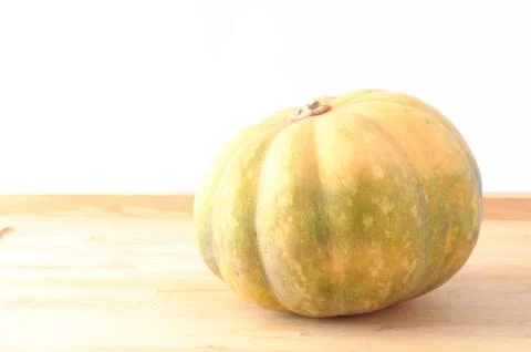 Pumpkin on wooden table Stock Photos
