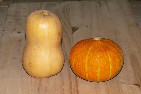 Pumpkin yellow , an red , on the table Stock Photos