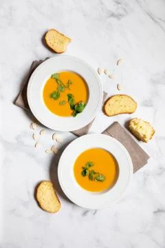 Pumpking soup served with bread top view 스톡 사진