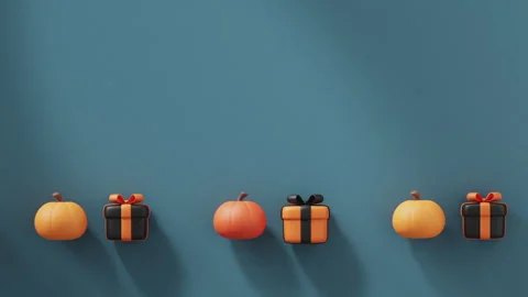 Pumpkins and gift boxes in Halloween colors roll pushing each other. Stock Footage 250777570