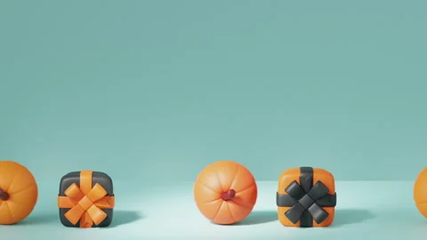 Pumpkins and gift boxes in Halloween colors roll pushing each other. Stock Footage 250777573