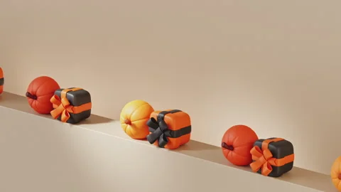 Pumpkins and gift boxes in Halloween colors roll pushing each other. Stock Footage 250777574