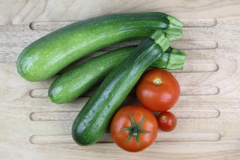 Pumpkins and tomatoes Stock Photos