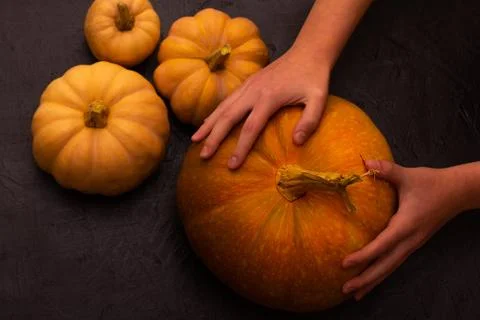 Pumpkins on black table. Halloween background Stock Photos